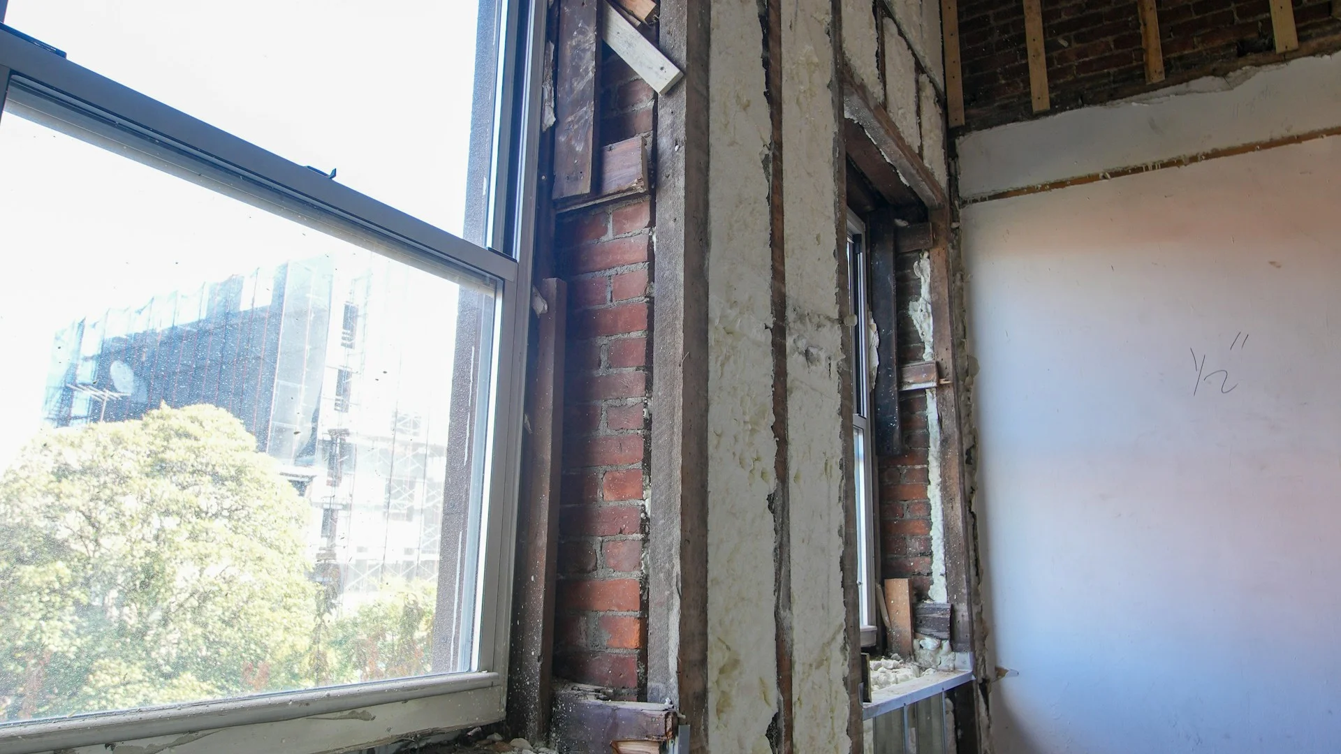 Worker installing building insulation
