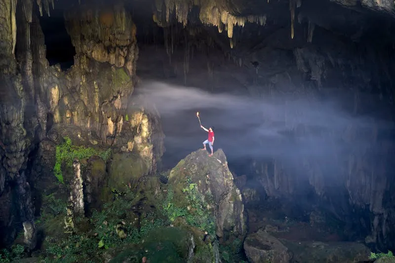 Explorer inside magnificent cave chamber