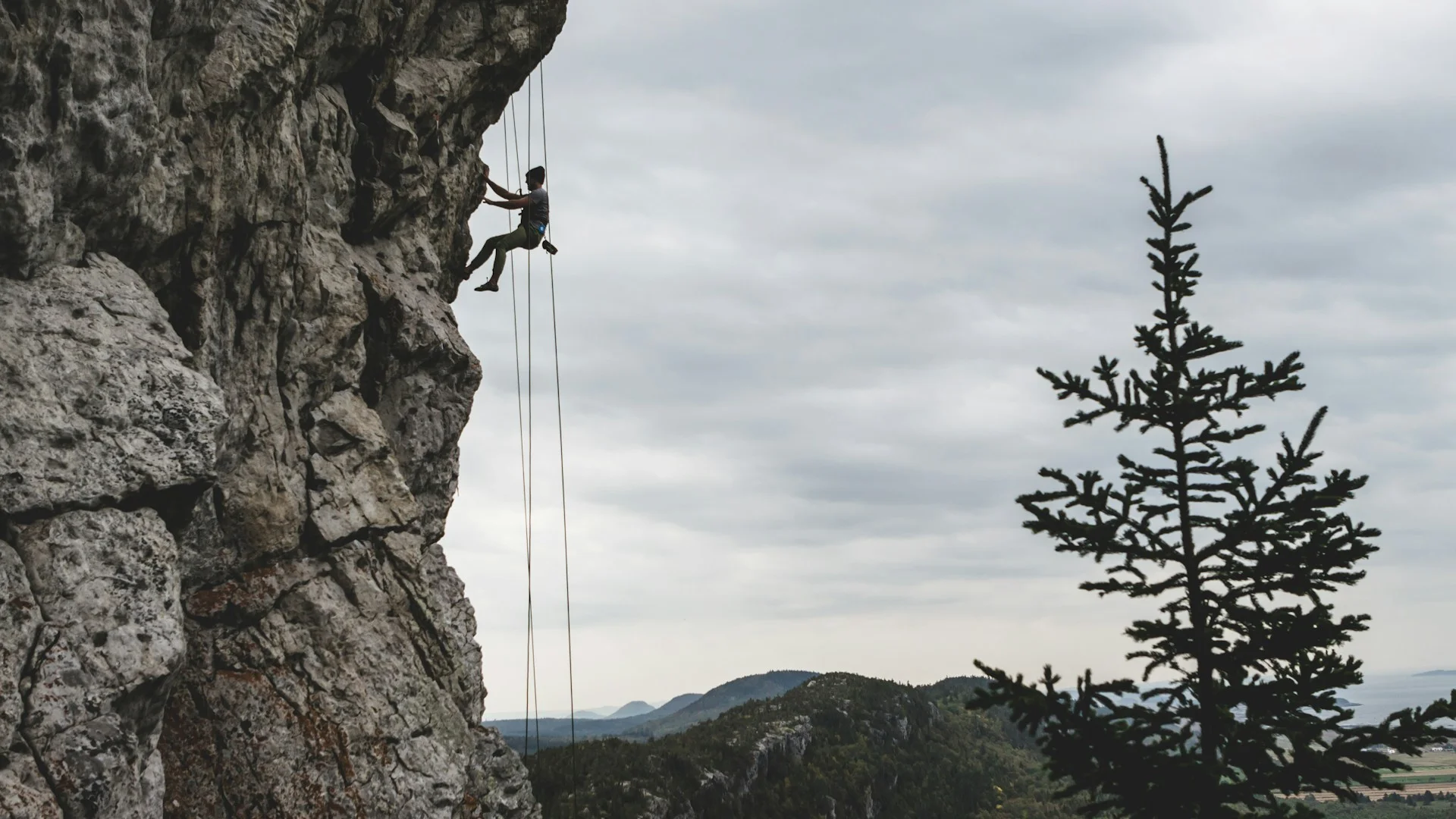 Rock climber on outdoor cliff face