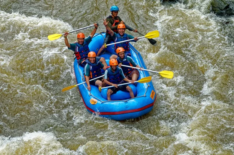 White-water rafting team navigating rapids