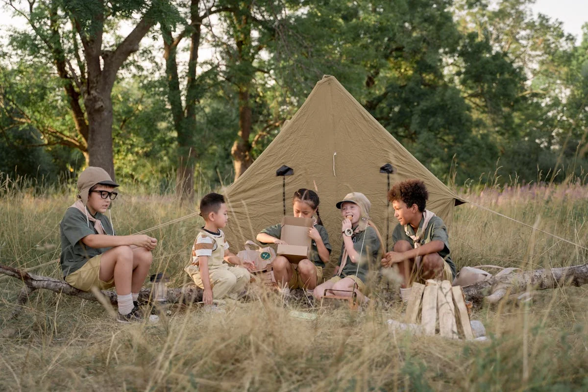 Children around campfire at dusk