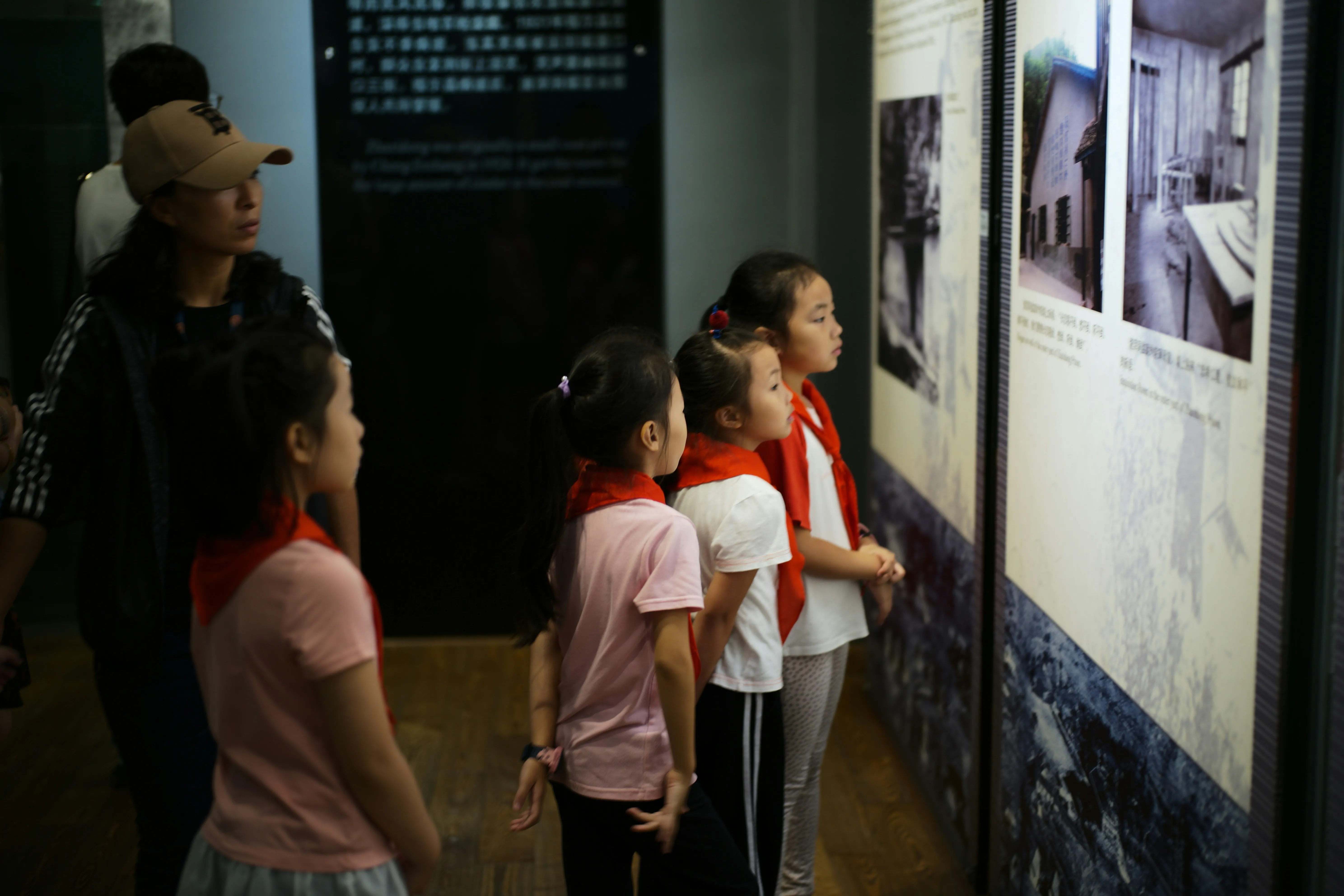 School group exploring museum exhibits