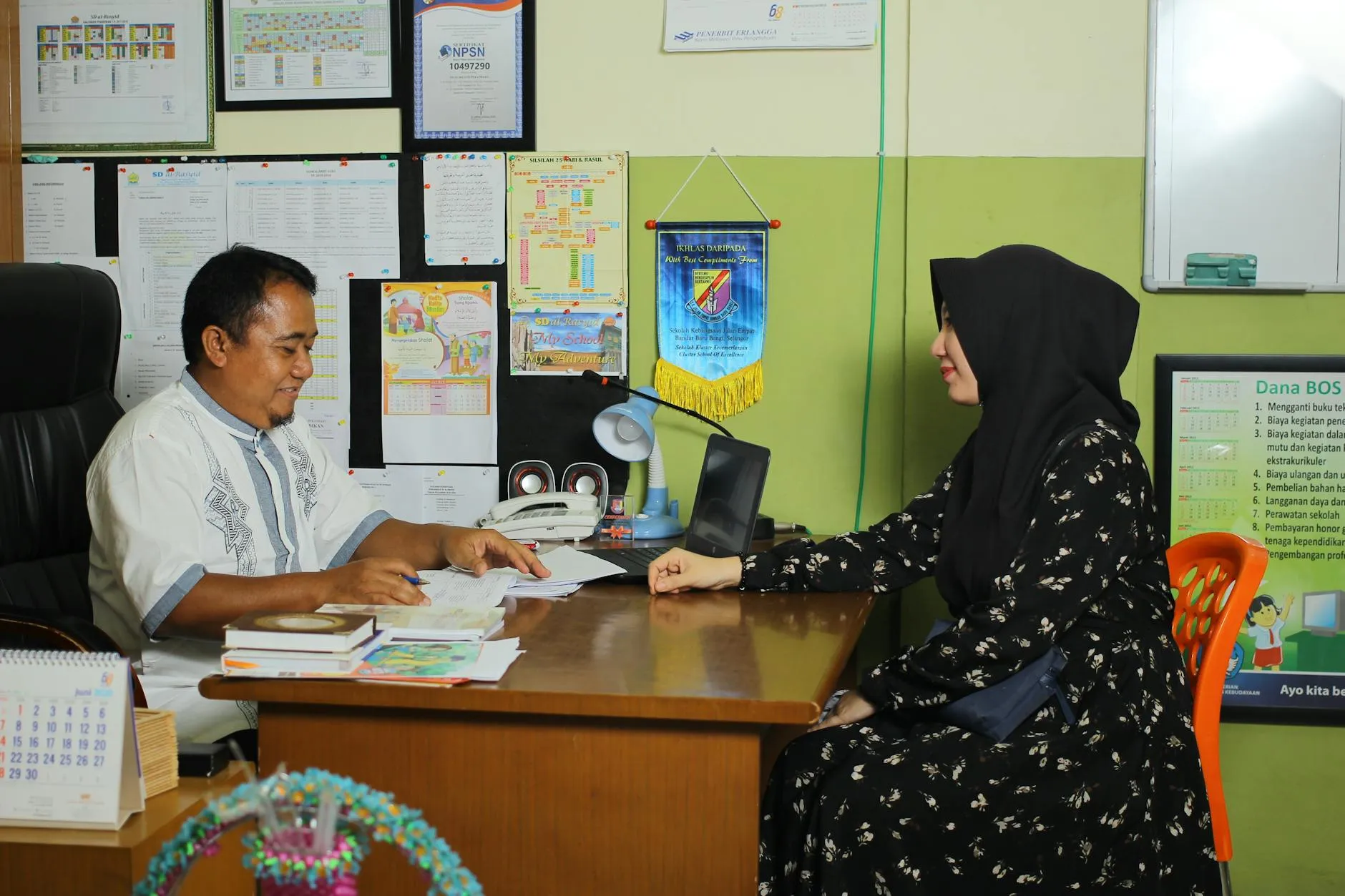 Parent and teacher discussing student progress