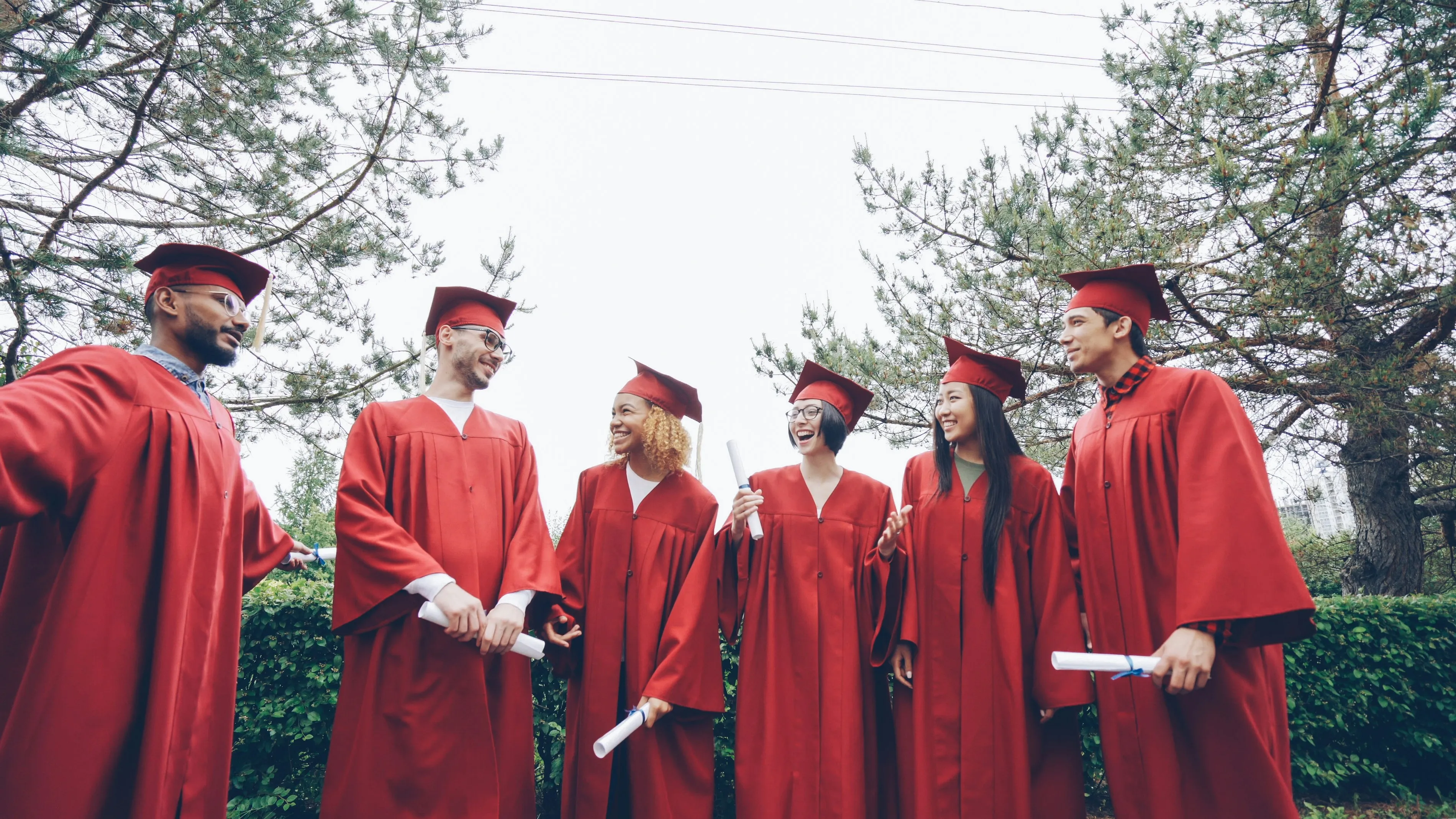 Graduate throwing cap in celebration