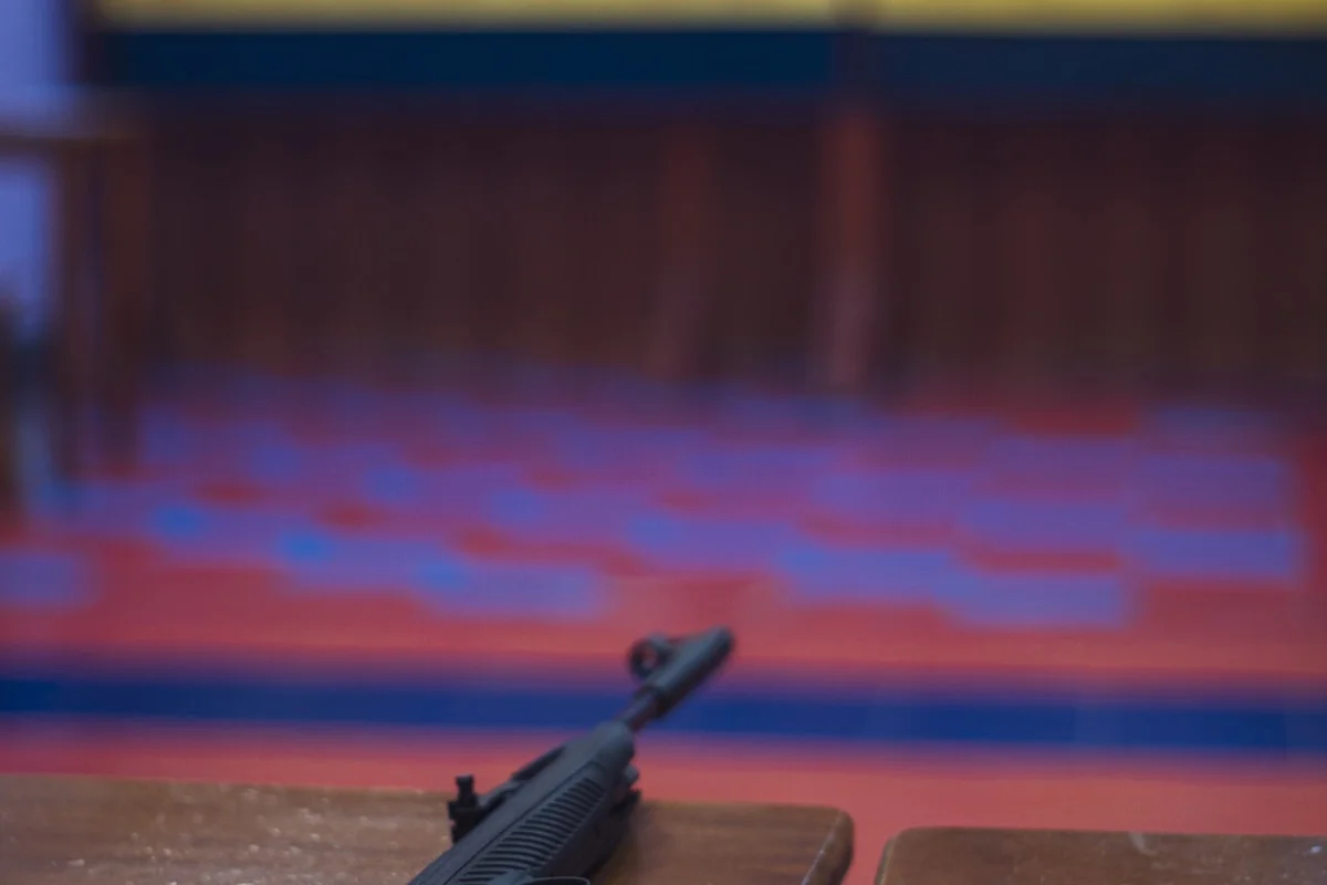 Target with rifle at shooting range