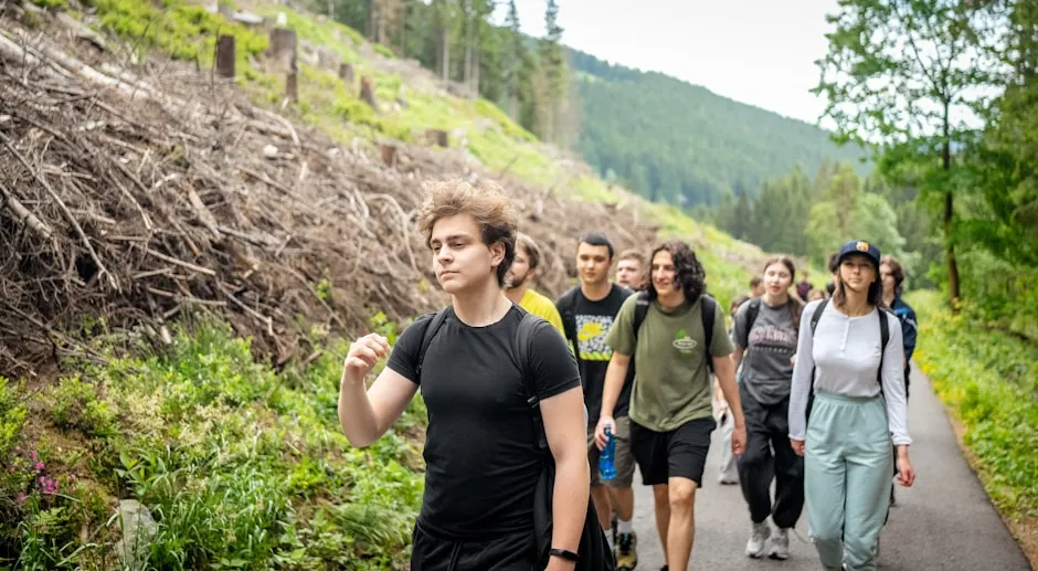 Youth group hiking on trail