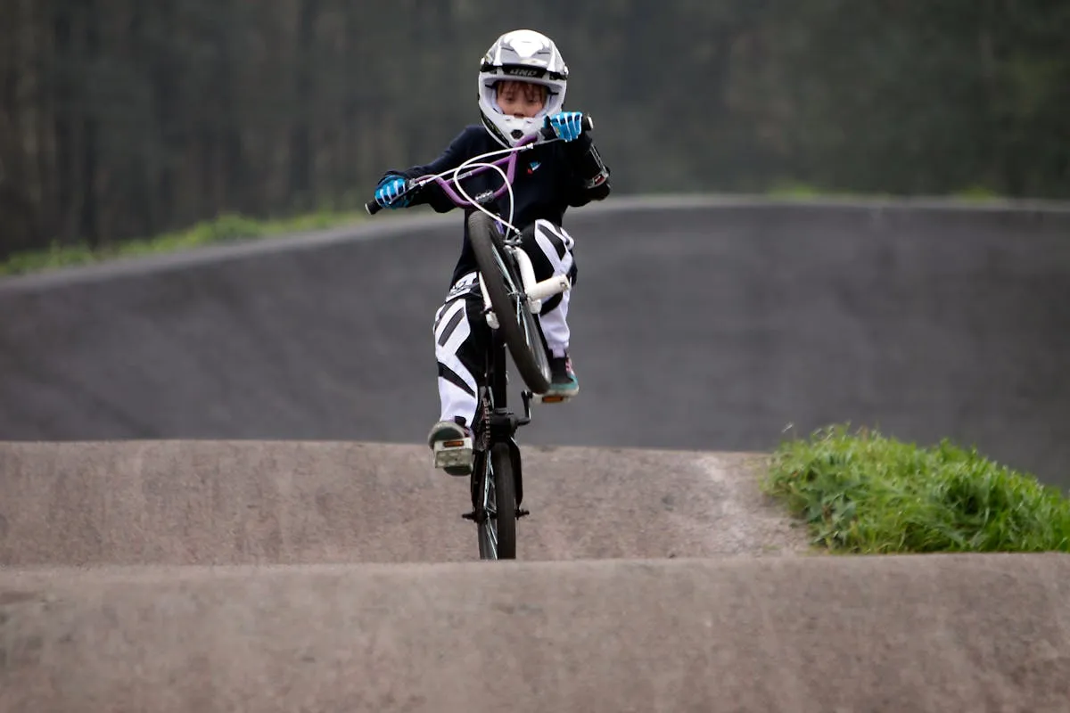 BMX rider racing on outdoor track