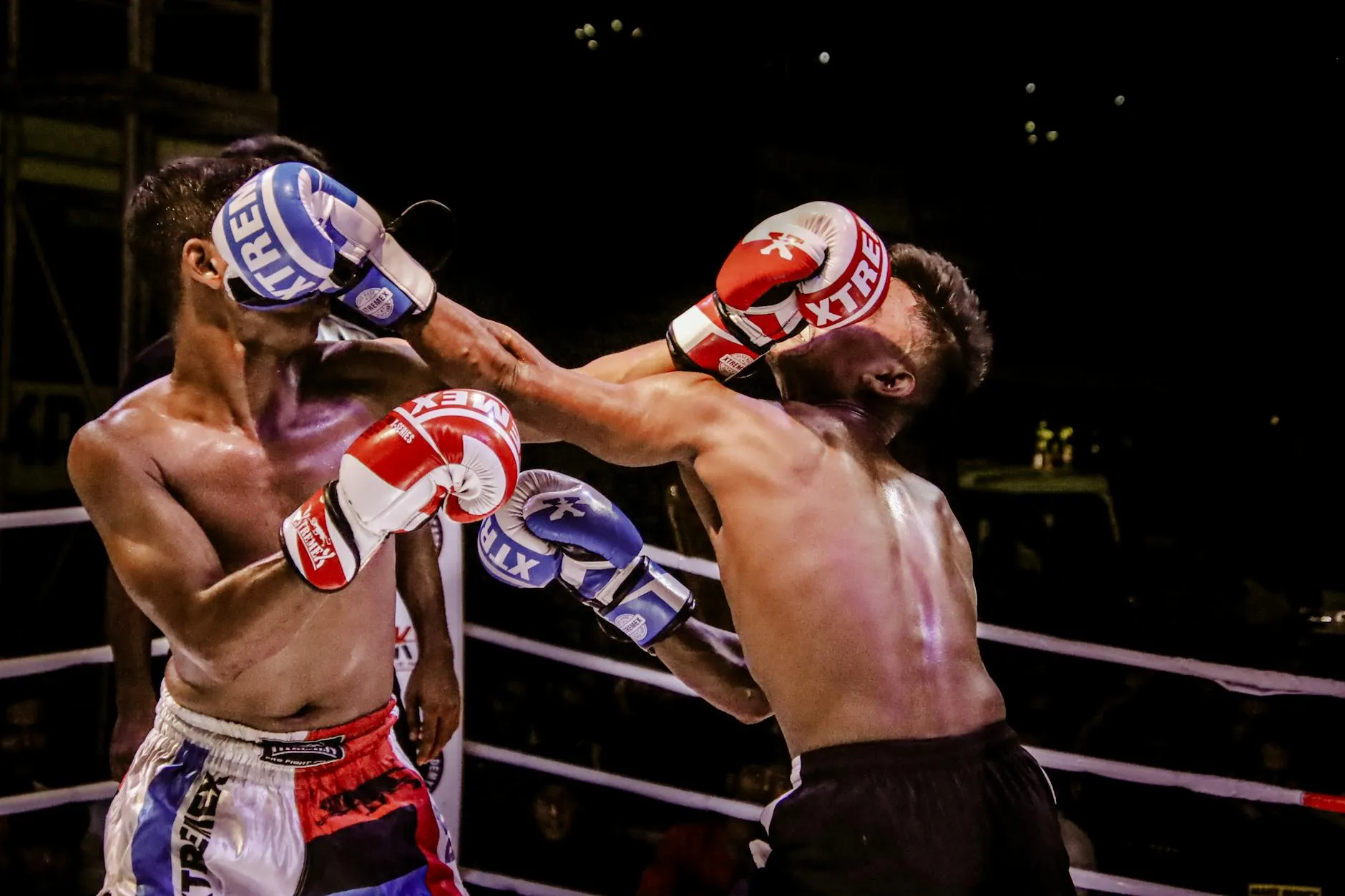 Two boxers competing in boxing ring