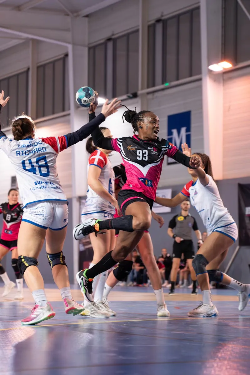 Indoor ball sport game action in gymnasium