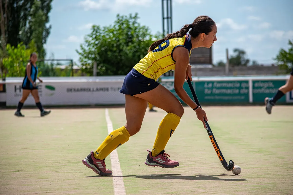 Female athlete playing field hockey