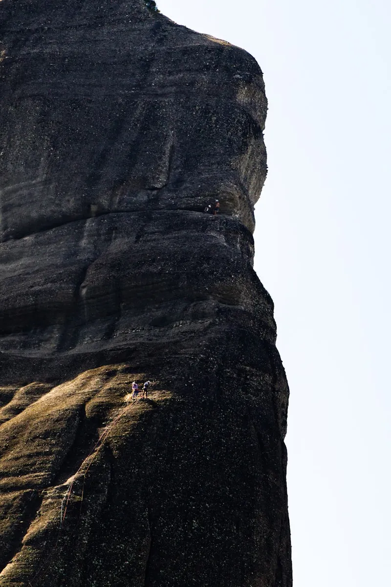 Climbers on mountain rock face