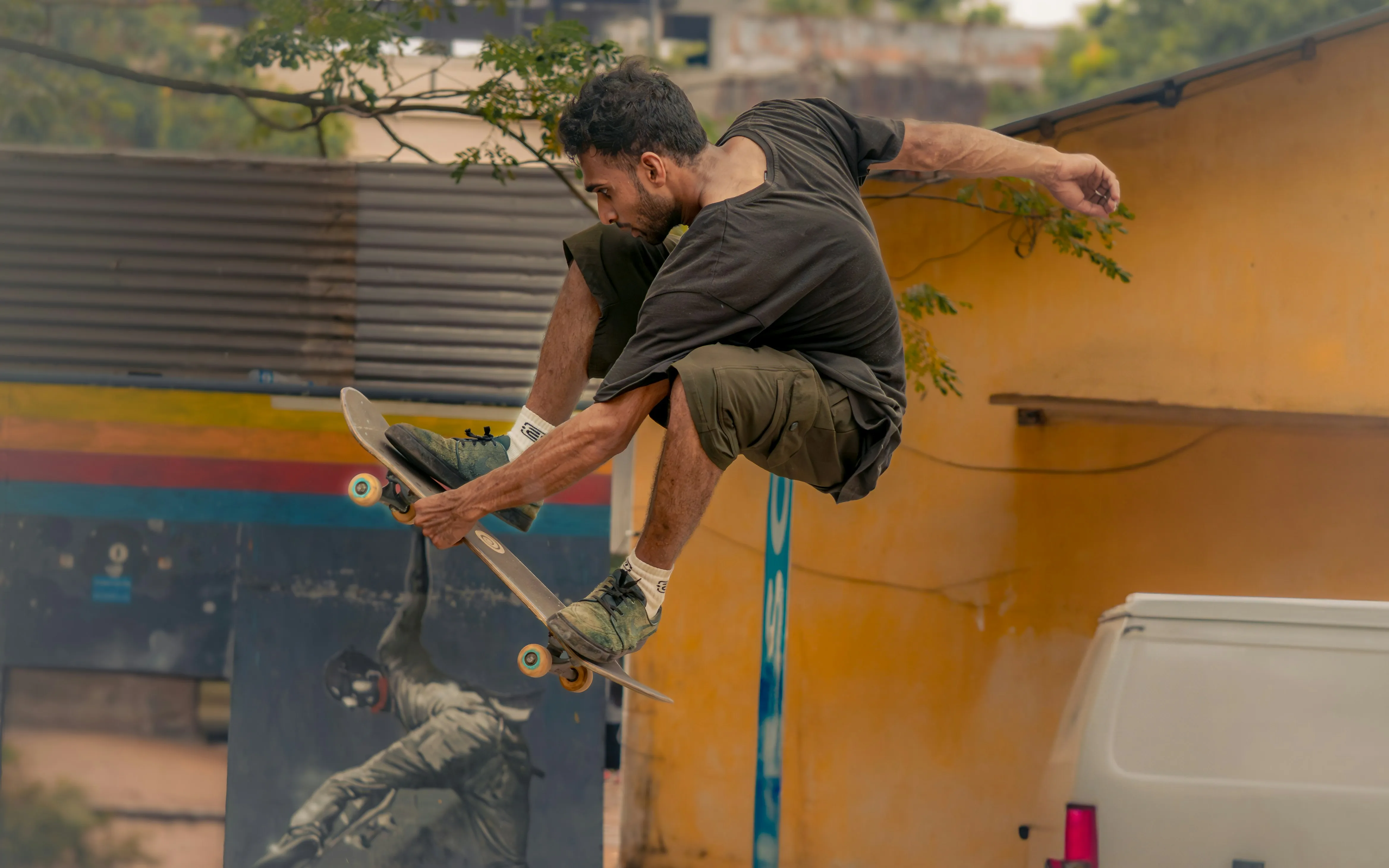 Skateboarder performing trick at skatepark