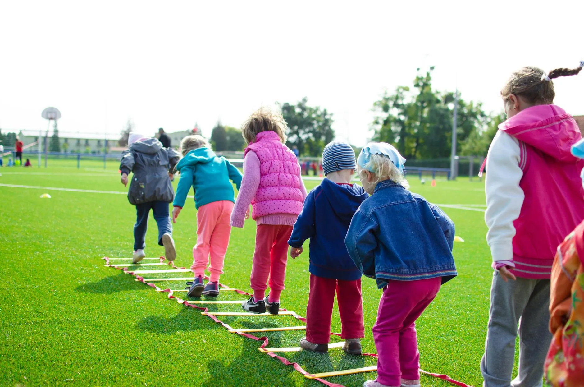 Youth playing field games outdoors