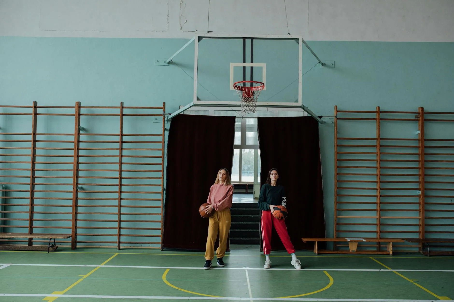 Young people playing sports in gym